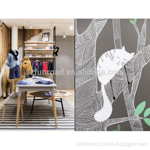 Kids store interior designs with interesting playground and clothing display cabinets